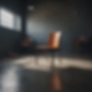 Eerie Isolation Metaphorical depiction of emptiness through a dark, empty room with a single chair