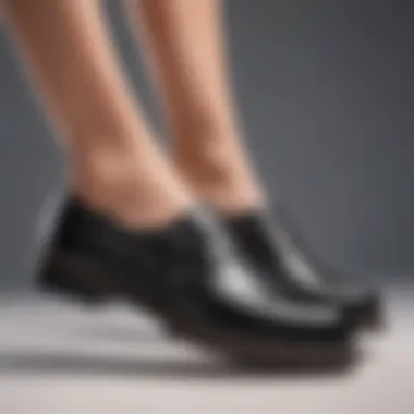 Close-up of arch support feature in black leather footwear