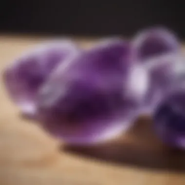 An amethyst gua sha stone displaying its rich purple tones, symbolizing tranquility.