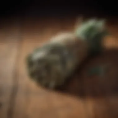 Essence of Sage: A Dried Bundle A vibrant bundle of dried sage tied with natural twine, resting on a clean wooden surface.