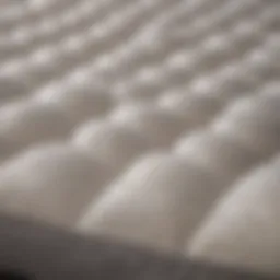 Close-up view of a soft mattress pad with quilted texture